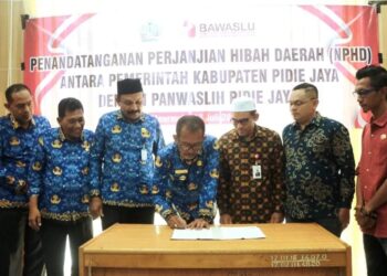 Pj Bupati Jailani Penandatanganan NPHD Panwaslih Pilkada Pidie Jaya