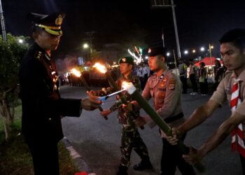 Kapolres Bener Meriah Pimpin Upacara Taptu Dan Pawai Obor Memperingati HUT RI Ke-79