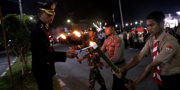 Kapolres Bener Meriah Pimpin Upacara Taptu Dan Pawai Obor Memperingati HUT RI Ke-79