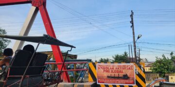 Warga Kota Tanjung Balai Tebarkan Spanduk Menolak Aktivitas Pekerja Migran Indonesia