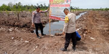 Polisi Pasang Spanduk Larangan Bakar Hutan di Kerumutan, Warga Diimbau Jaga Lingkungan