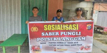Akhir Pekan, Polsek Langgam Gencarkan Sosialisasi Saber Pungli di Wilayah Pelayanan Publik