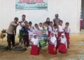 Polisi Bunut Tanam Bibit Pohon Kelengkeng di SDN 006 Desa Petani Pelalawan