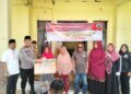 Bhabinkamtibmas Desa Angkasa Hadiri Penyerahan BLT dan Santunan Anak Yatim