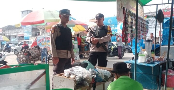 Polsek Ukui Gencarkan Patroli Pasar Tradisional, Wujudkan Rasa Aman Pedagang dan Pembeli