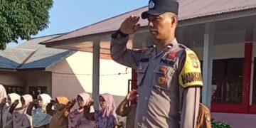 Bhabinkamtibmas Jadi Pembina Upacara di SDN 019 Pematang Tinggi, Sampaikan Pesan Disiplin hingga Anti-Bullying